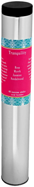 The Tranquility tube: a brushed metal cylinder with a black lid and a pink label edged in teal